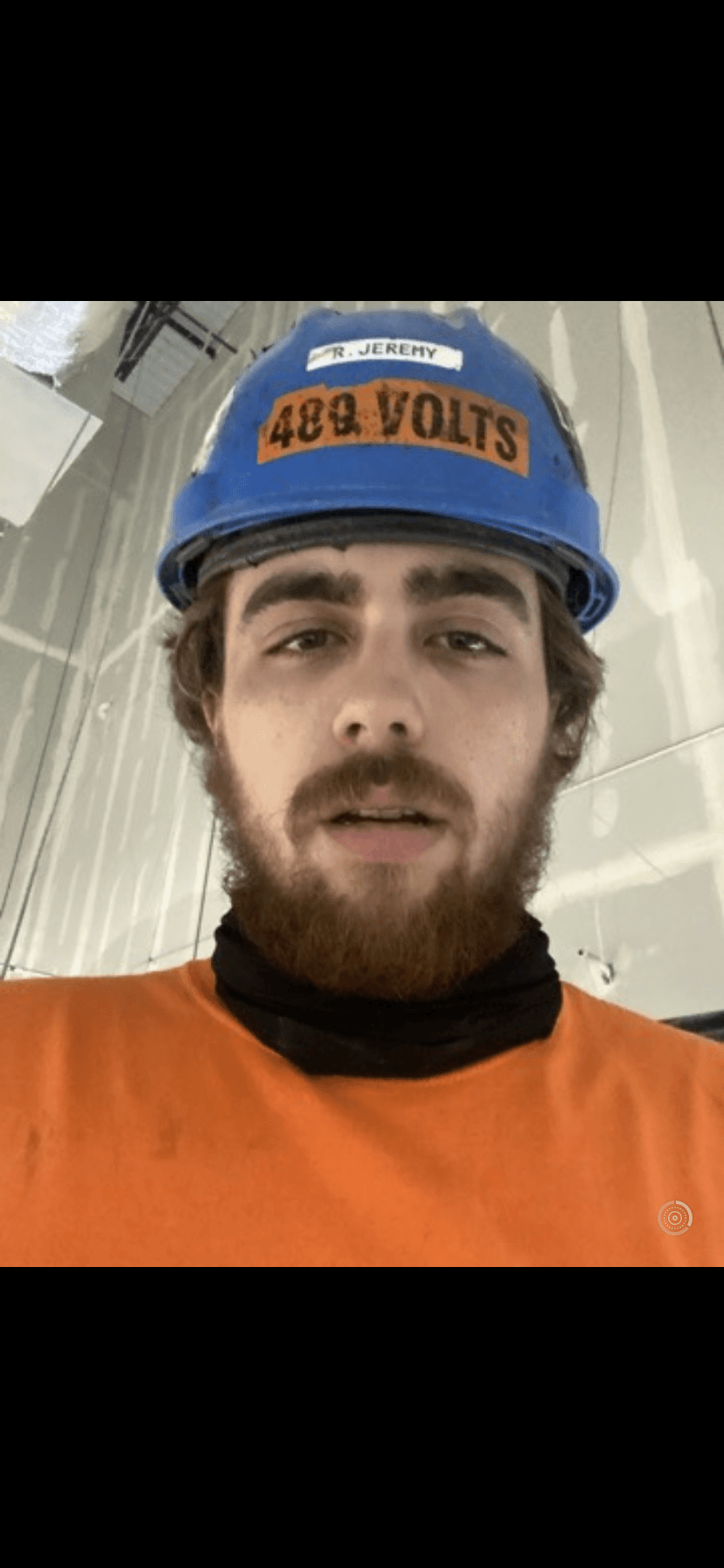 Michael in arc-flash PPE doing electrical work